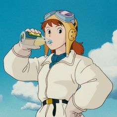 an anime character drinking from a cup with her headphones on and wearing a pilot's helmet