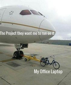 an airplane sitting on the tarmac with a bike attached to it's front wheel