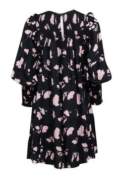 This pink printed long-sleeve dress from Joie is a delicate piece for spring. Sweet details like smocking, mini length, and shoulder ruffles are given a slight edge from the black background. Wear simply on the weekends with slide sandals or dress up with a wedge heel. Size S 100% Lyocell Babydoll silhouette Smocked neckline, back, and sleeve cuffs Back keyhole w/ button closure Side pockets Bust 36" Waist 48" Shoulder to hem 33.5" Sleeve length 23.5" Spring Pink Long Sleeve Dress With Ruffles, Casual Long Sleeve Ruffled Dress For Spring, Spring Flowy Long Sleeve Dress With Ruffles, Pink Long Sleeve Dress With Ruffles For Fall, Pink Smocked Dress With Puff Sleeves For Daywear, Spring Pink Smocked Dress With Elastic Sleeves, Pink Smocked Dress With Elastic Sleeves For Spring, Spring Smocked Mini Dress, Casual Pink Smocked Dress With Gathered Sleeves