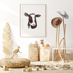 a cow is on the wall next to some toys and other items in front of it