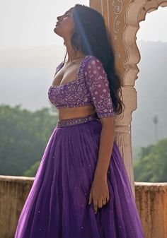 Your sangeet party lehenga ! This enchanting lehenga features a pleated, pure satin organza lehenga in a majestic purple hue, adorned with intricate embroidery that sparkles under the lights. The sweetheart neck blouse with its delicate floral embroidery, adds a touch of sophistication to your look. A flowing satin organza dupatta completes this breathtaking outfit, ensuring you'll be the centre of attention at any festive occasion. Perfect for brides and guests alike, this lehenga set is an exquisite choice for those seeking to make a statement in style. Composition : Lehenga, Dupatta - Satin Organza, Blouse - Soft Net Care: Dry Clean Only and Vacuum Storage This product can be customized for sleeves, length of blouse and neckline Delivery : 4-6 weeks as the product is hand crafted. Check Party Lehenga, Sweetheart Neck Blouse, Lehenga Ideas, Simple Frock Design, Bridal Lehenga Designs, Simple Lehenga, Lehenga Dupatta, Organza Lehenga, Long Gown Design