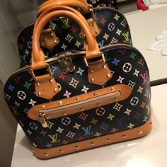 Special Edition LV Multi Color Alma 100% Authentic!!  Only 300 made. I was one of the first few customers to get it  Worn only 3 times. Such a great sturdy bag Excellent condition ⭐️ ⭐️ ⭐️ ⭐️ ⭐️ Louis Vuitton Bags Bolsa Luis Viton, Lui Viton, Luis Viton, Louis Vuitton Bag Limited Edition, Lv Colorful Bag, Rainbow Louis Vuitton Bag, Colorful Louis Vuitton Bag, Louis Vuitton Multicolor Bag, Louis Vuitton Graffiti Bag