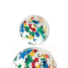 two glass balls with colorful stars on them