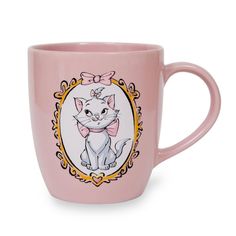 a pink coffee mug with a cat wearing a bow on it's head and an ornate frame around the cup