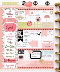 an open planner with pink and green accents