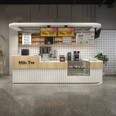 the front desk of a restaurant with menus on the wall and shelves above it