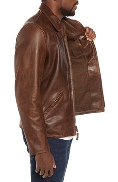 A high polish elevates the look of a full-grain leather jacket constructed with a soft cotton lining and shoulder-broadening sunray seaming on the back. Front zip closure Spread collar Angled welt pockets; interior pocket Adjustable side tabs with buckle closures Lined Buffalo leather Professional leather clean Made in the USA Fitted Leather Jacket With Double-needle Stitching For Winter, Fitted Leather Jacket With Double-needle Stitching For Fall, Rugged Leather Outerwear For Spring, Classic Leather Outerwear With Contrast Stitching, Classic Leather Jacket With Contrast Stitching, Fitted Leather Jacket With Contrast Stitching, Fall Leather Jacket With Contrast Stitching, Rugged Fitted Leather Jacket For Work, Leather Jacket With Contrast Stitching