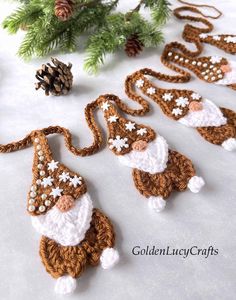 crocheted christmas ornaments are arranged on a table