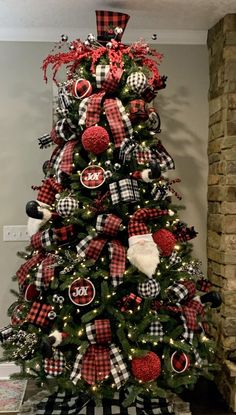 a christmas tree decorated with red, black and white ornaments