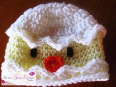 a crocheted hat with a ducky face