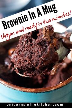 a spoon full of brownie in a mug with the words vegan and ready in two minutes