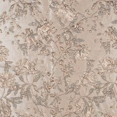 an image of a fabric with flowers and leaves on the back in grey tones,