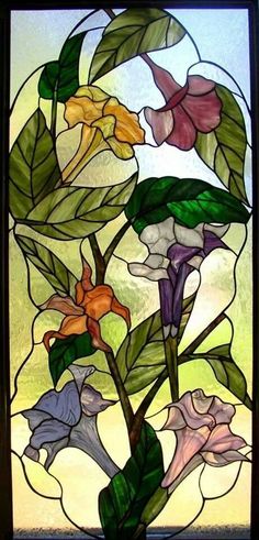 a stained glass window with flowers in it