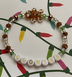 a close up of a bracelet with words on it and a monkey in the background