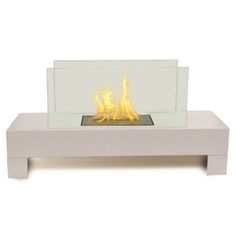 a white table with a glass fire place on top and flames burning in the middle