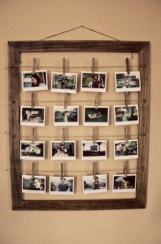 an old wooden frame with photos hanging on it