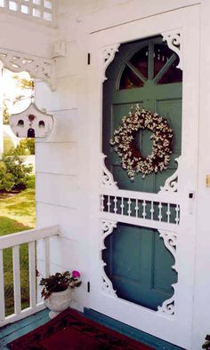 a green door with a wreath on it