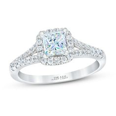 a white gold engagement ring with a princess cut diamond surrounded by round brilliant pave diamonds