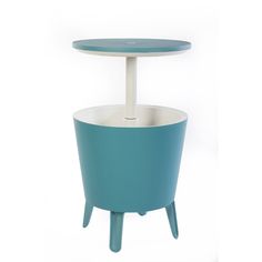 a blue planter sitting on top of a white table