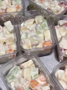 several plastic containers filled with different types of food