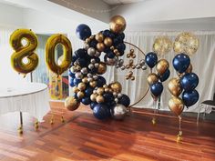 balloons and streamers in the shape of numbers are on display at an 80th birthday party