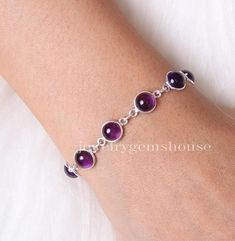 Amethyst Bracelet, 925 Sterling Silver Bracelet, February Birthstone Bracelet, Gemstone Jewelry, Handmade Bracelet, Birthday Gift For Her Gemstone - Amethyst  Stone Quality - AAA  Weight - 6.36 gm  Stone Length- 0.7 cm, Stone Width - 0.7 cm Bracelet Length - 6 inch to 9 inch sizes are available, we give 0.5 inch adjustable in the size which you order ( NOTE - 0.5 INCH ADJUSTABLE IS INCLUDED IN YOUR ORDERED SIZE ) Stone Shape - As shown in the picture We serve complete 925 sterling silver Jewelry and genuine properties of the stone. The products are dispatched from the small business from UK. Product Quality and Packaging - Our all products are 925 Silver Stamped which shows that the product is genuine and authentic .The products are dispatched from the small business from UK so you get the Adjustable Jewelry, Amethyst Bracelet, Birthstone Bracelets, Wedding Jewelry Bracelets, February Birth Stone, Amethyst Stone, Amethyst Gemstone, Wedding Bracelet, 925 Sterling Silver Jewelry