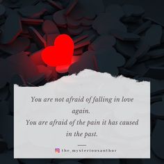 a red heart sitting on top of a piece of paper with the words you are not afraid of falling in love again