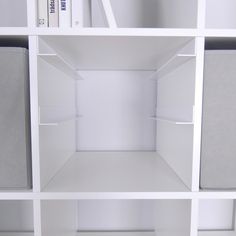 an empty white shelf with books on it