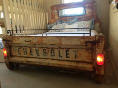 an old truck bed with the word chevrolet written on it's side and lights turned red