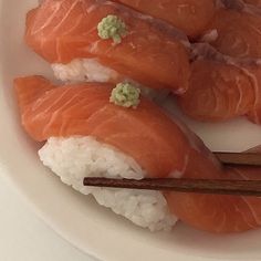 sushi with chopsticks in a white bowl