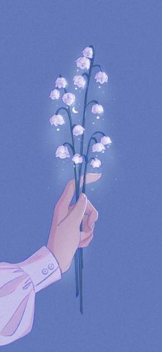 a hand holding a bunch of white flowers against a blue sky with the word love written on it