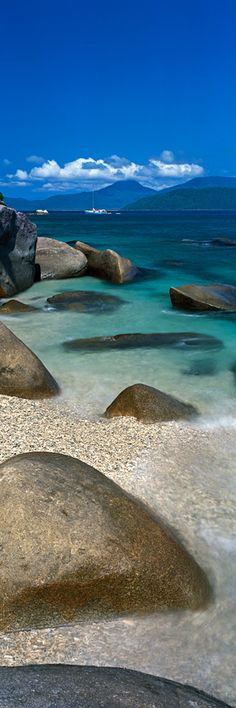 some rocks and water near the shore