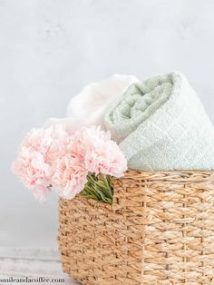 pink carnations and towels in a basket on a white background with text overlay