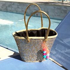 Our favorite medium sized mixed metal bag! This fully adorned silver and gold sequin straw bag is all about mixing and matching! This straw bag is hand woven with locally sourced Marrakech wicker palm straw. It has hand sewn silver and gold sequins. The handles are genuine gold leather and are also handcrafted by Moroccan artisans. This medium sized bag is very versatile. It can fit your towels and accessories for a day at the beach or by the pool, can be an eco-friendly alternative to plastic b Gold Bucket Straw Bag For Travel, Gold Tote Straw Bag For Beach, Gold Straw Tote Bag For Vacation, Gold Tote Straw Bag For Vacation, Gold Straw Tote Bag For Beach, Gold Rectangular Straw Bag With Handles, Gold Bag For Vacation, Gold Straw Tote Bag For Travel, Gold Tote Straw Bag For Travel