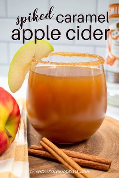 an apple cider is garnished with cinnamon and apples for the perfect fall drink