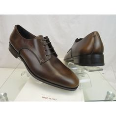 Daniel Burnished Brown Brogue Leather Lace Up Derby Oxfords By Salvatore Ferragamo Made In Italy 100% Authentic,Guaranteed !!!!! Size: Us 10.5 E Color: Moro (Print On The Box) Calf Leather Upper Leather Lined Flat Oiled Laces "Salvatore Ferragamo" Stamped Leather Insole Lettering Signature Stamped Rubber/Leather Sole Almond Toe Original Price: $795 Note !!! These Shoes Came From Ferragamo's Brand Name Store In Its Original Box. They Are New But They Are In-Store Item And It’s Possible That Someb Brown Luxury Oxfords For Derby, Beige Leather-sole Oxfords For Derby, Semi-formal Cognac Oxfords With Brogue Detailing, Brown Brogues, Luxury Brown Semi-formal Oxfords, Brown Leather-lined Oxfords For Derby, Signature Stamp, Salvatore Ferragamo Shoes, Leather And Lace