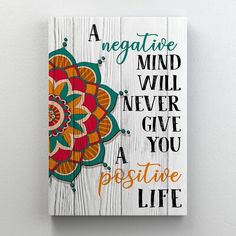 a wooden sign that says, a negative mind will never give you a positive life