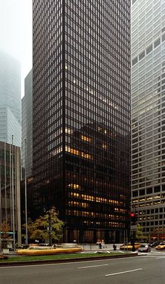 an empty street in front of tall buildings