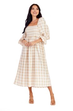 The Byerly Plaid Midi Dress offers women a stylish and comfortable choice. Crafted from a poly blend fabric, this dress showcases a timeless gingham pattern. The smocked chest adds a flattering and feminine touch, while the 3/4 sleeves with ruffle detail bring a playful and trendy vibe. With a length of approximately 48" from shoulder to hem, this midi dress is suitable for any occasion. It is easy to maintain, as it can be machine washed cold separately. For best results, use the gentle cycle a Gingham Midi Dress, Kids Candles, Gingham Pattern, Hand Crafted Furniture, Gingham Dress, Gingham Print, Bottom Clothes, Door Wreath Hanger, Clothes Gift