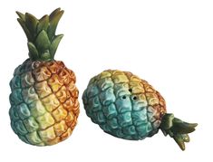 two colorful pineapples are shown on a white background