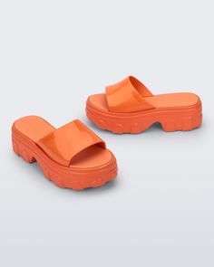 An edgy take on your traditional platform, the Ella Slide brings inspiration from the fisherman-style sandal designed for those who embrace their unique style. With a treaded heel, wide strap, and EVA insole, comfort is top of mind, but being fashionable is always number one. Casual Chunky Platform Sandals With Closed Toe, Trendy Closed Toe Sandals With Thick Bottom, Trendy Jelly Sandals With Rubber Sole For Summer, Trendy Summer Jelly Sandals With Rubber Sole, Bold Platform Sandals For Spring, Summer Sport Sandals With Platform And Open Heel, Platform Sport Sandals With Open Heel For Summer, Bold Spring Platform Sandals, Summer Chunky Platform Slip-on Sandals