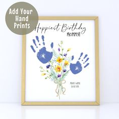 a birthday card with flowers and hand prints on it, in front of a white background