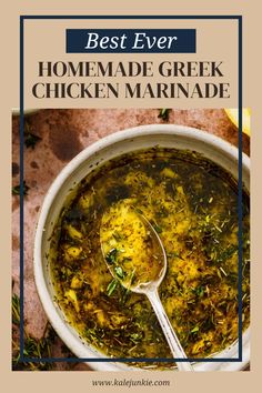 the best ever homemade greek chicken marinade in a white bowl with a spoon on top