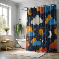 a bathroom with a shower curtain that has cartoon clouds and stars on it, along with a bathtub