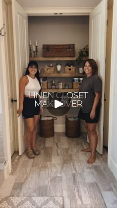 two women standing next to each other in front of an open closet with baskets on the floor