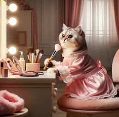 a cat in a pink dress sitting at a desk with makeup brushes and other items