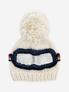 The perfect beanie for little skiers, and non-skiers alike. Our Cream ski hat featuring a Navy, Cinnamon, Mustard, and Bowie Grey goggle band is the perfect blend of warmth, comfort, and style, while the pom-pom and silver metallic details add dimension and design to this epic beanie. Pair with our Classic Cream, Navy, Cinnamon, or Bowie Grey Cardigan or Mittens for a complete look. Final design may vary slightly from the pictured mockup. Crafted with care using 100% Hand-knit Acrylic All measur Baby Skiing, Retro Ski, Ski Hat, Baby Gift Box, Ski Hats, Hand Knit Hat, Ski Goggles, Retro Stripes, Buy Buy