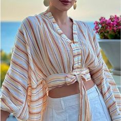 Super Cute Tie Front. Modern And Stylish Yet Beautiful With An Old Hollywood Flair. New With Tag! Sold Out Everywhere! Photo Credit To Sadaf_beauty Diary On Instagram Chic Striped Top For Vacation, Beige Long Sleeve Tops For Vacation, Long Sleeve Beige Tops For Vacation, Summer Beige V-neck Top, Striped Summer Top For Brunch, Beige Cropped Tops For Brunch, Beige Long Sleeve Summer Crop Top, Striped V-neck Summer Tops, Beige Long Sleeve Crop Top For Summer