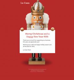 a merry christmas and a happy new year 2011 holiday card with a nutcracker holding a sign