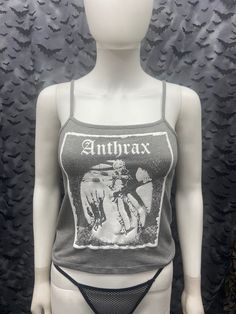 This is a gray Anthrax crop tank top with spaghetti straps. This has a Anthrax image screen printed on the front. 57% cotton/ 38% polyester/ 5% Spandex These are handmade screenprinted and slightly vary from the photo. Please feel free to email me any questions. Thanks for looking. Due to an influx of incorrect addresses if a package is returned, you must pay the shipping cost to resend the item to you. The seller is not responsible for any lost or stolen packages. Gray Cotton Punk Style Top, Gothic Cropped Top For Summer, Gothic Cropped Crop Top For Summer, Gothic Tank Top For Halloween Concert, Gothic Halloween Tank Top For Concerts, Grunge Halloween Graphic Print Tank Top, Halloween Grunge Graphic Print Tank Top, Gothic Fitted Top With Spaghetti Straps, Halloween Cotton Tank Top With Graphic Print